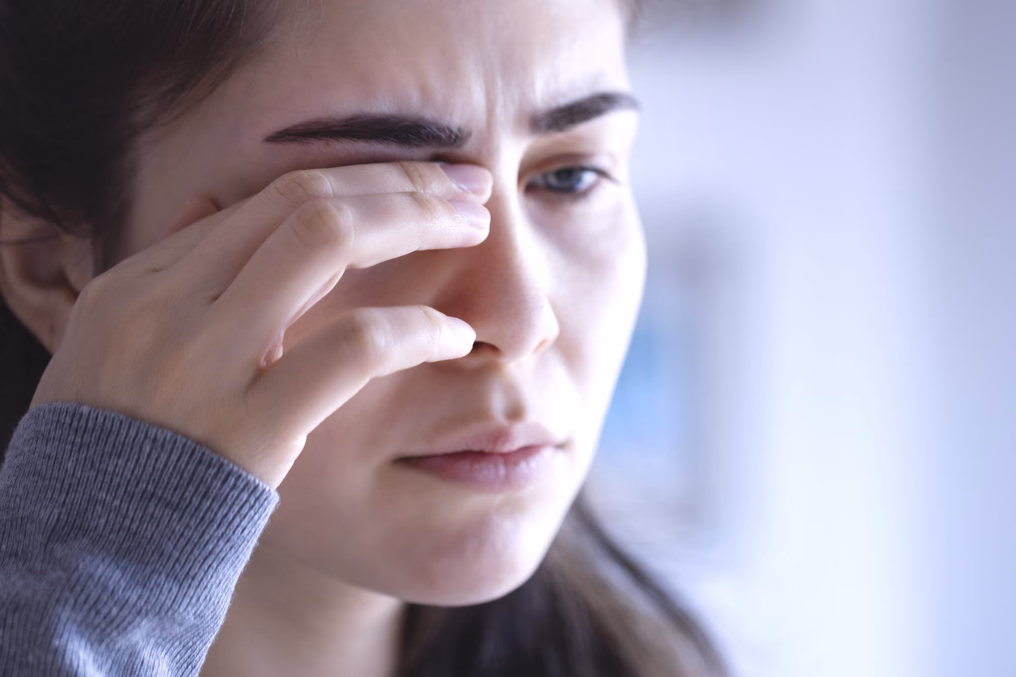 Eye Pain-Acanthamoeba Woman rubbing her eye
