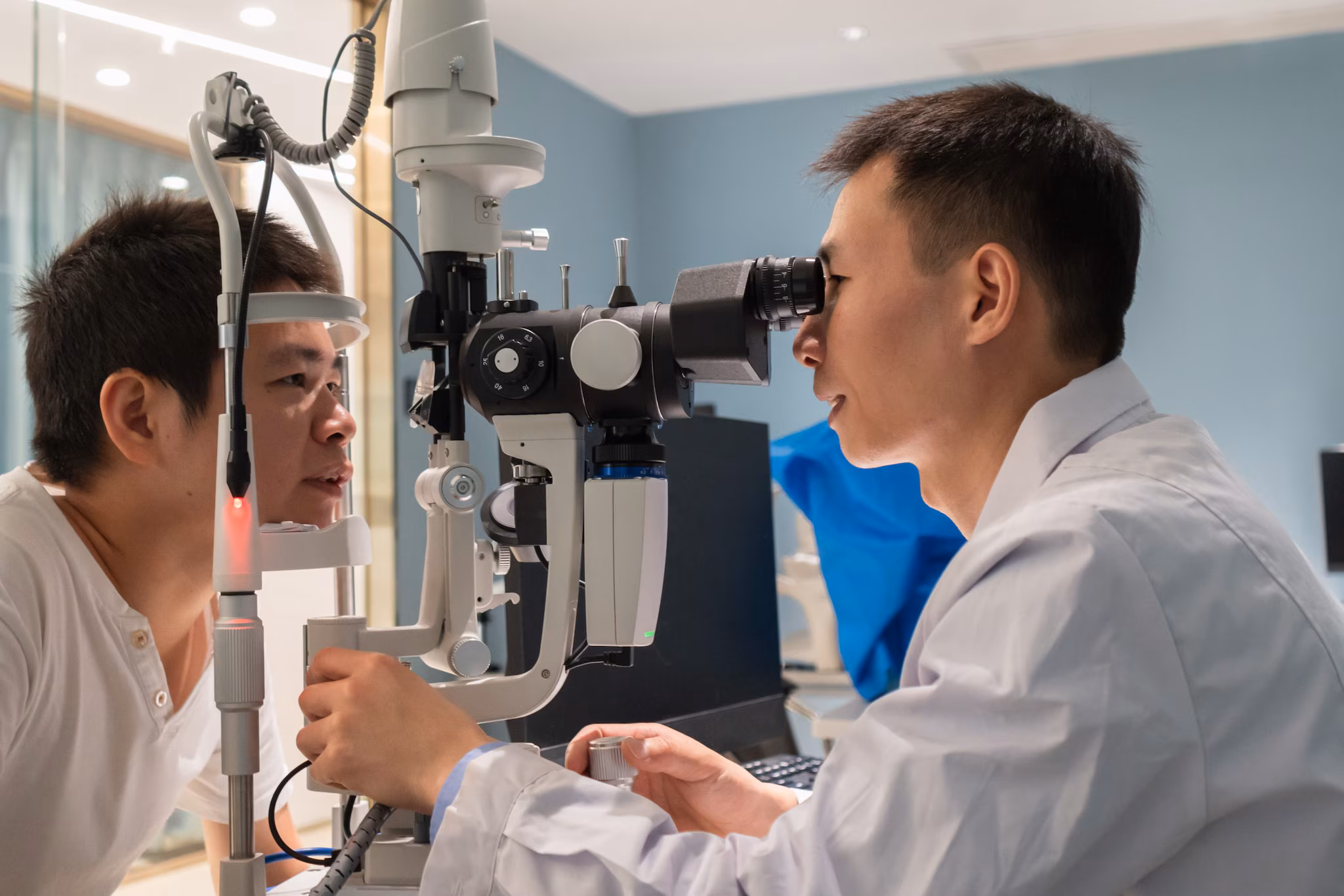 Eye exam-Acanthamoeba A man gets an exam an eye doctor