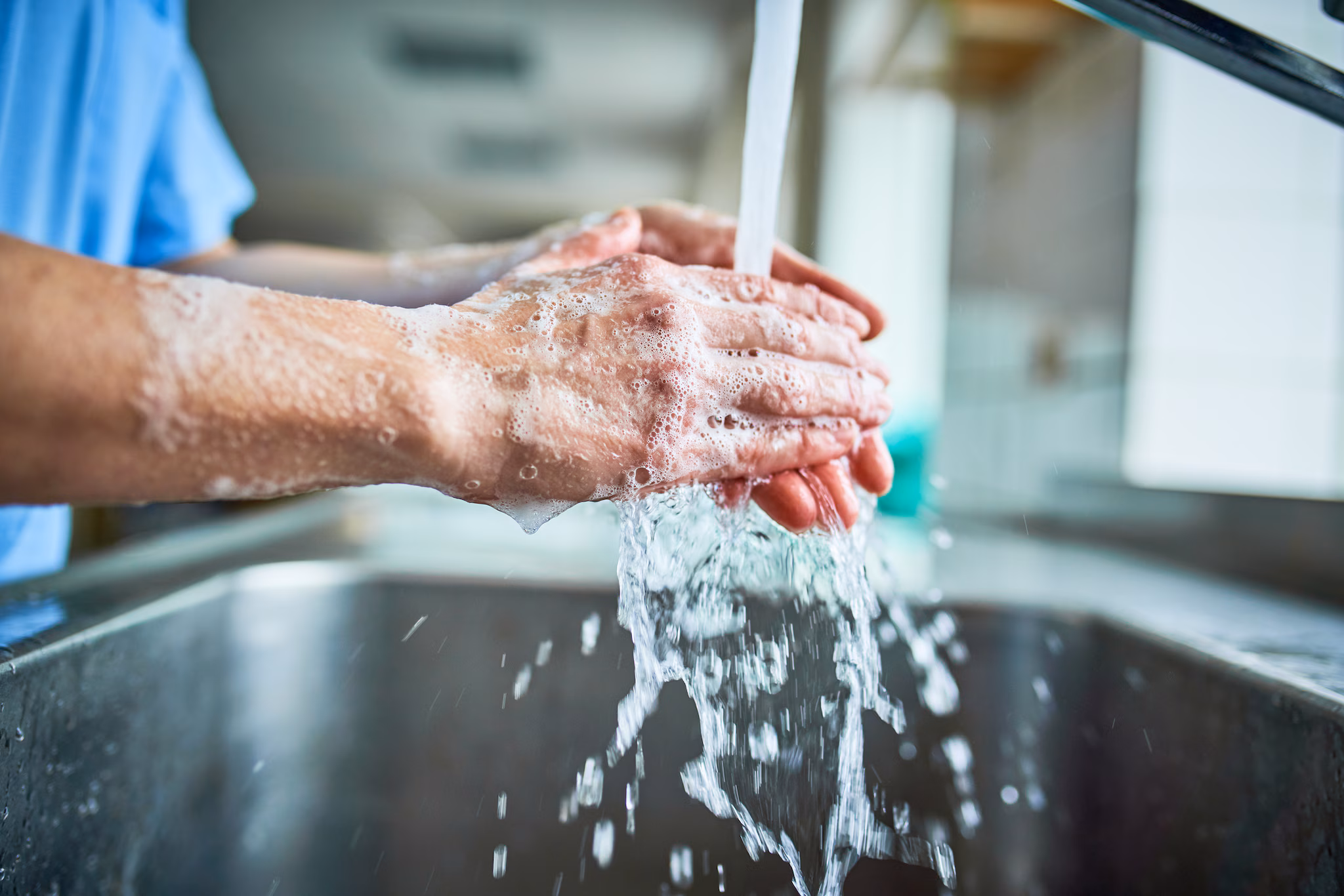 A healthcare provider thoroughly washing hands