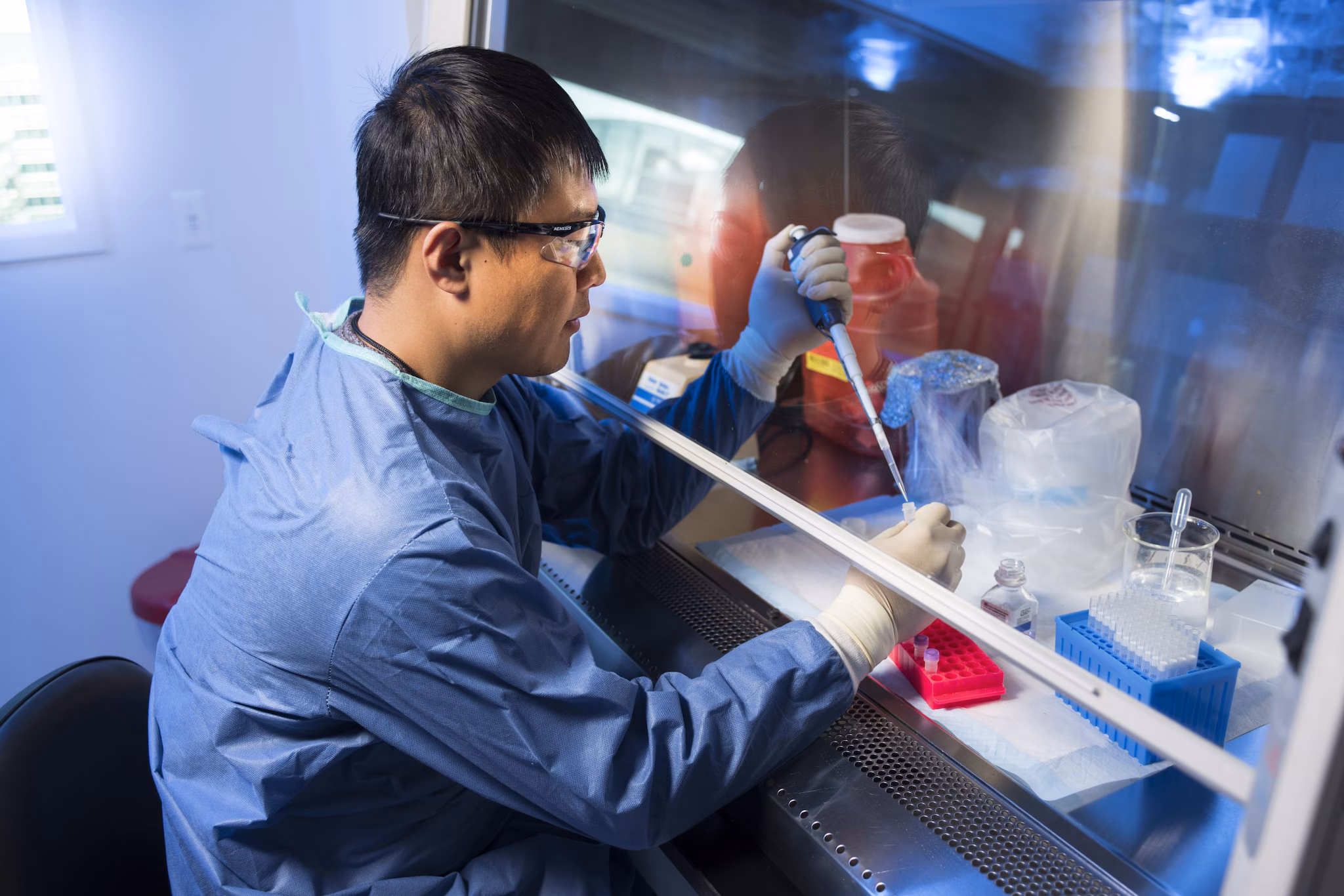 A lab scientist testing a sample.