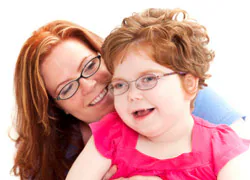 Mom and a Daughter with Disabilities A mother holds a daughter with dsiabilities.