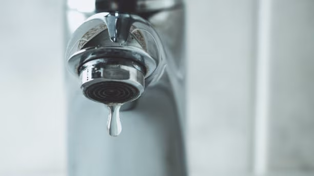 — title missing — Water faucet with a drop of water coming out