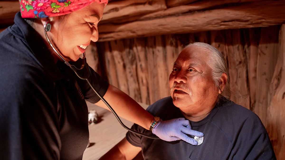 Doctor-patient-stethoscope A healthcare provider uses a stethoscope with a patient