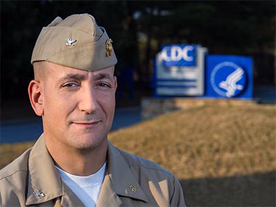 dr-eric-pevzner-400px Doctor Eric Pevzner headshot in front of CDC headquarters sign