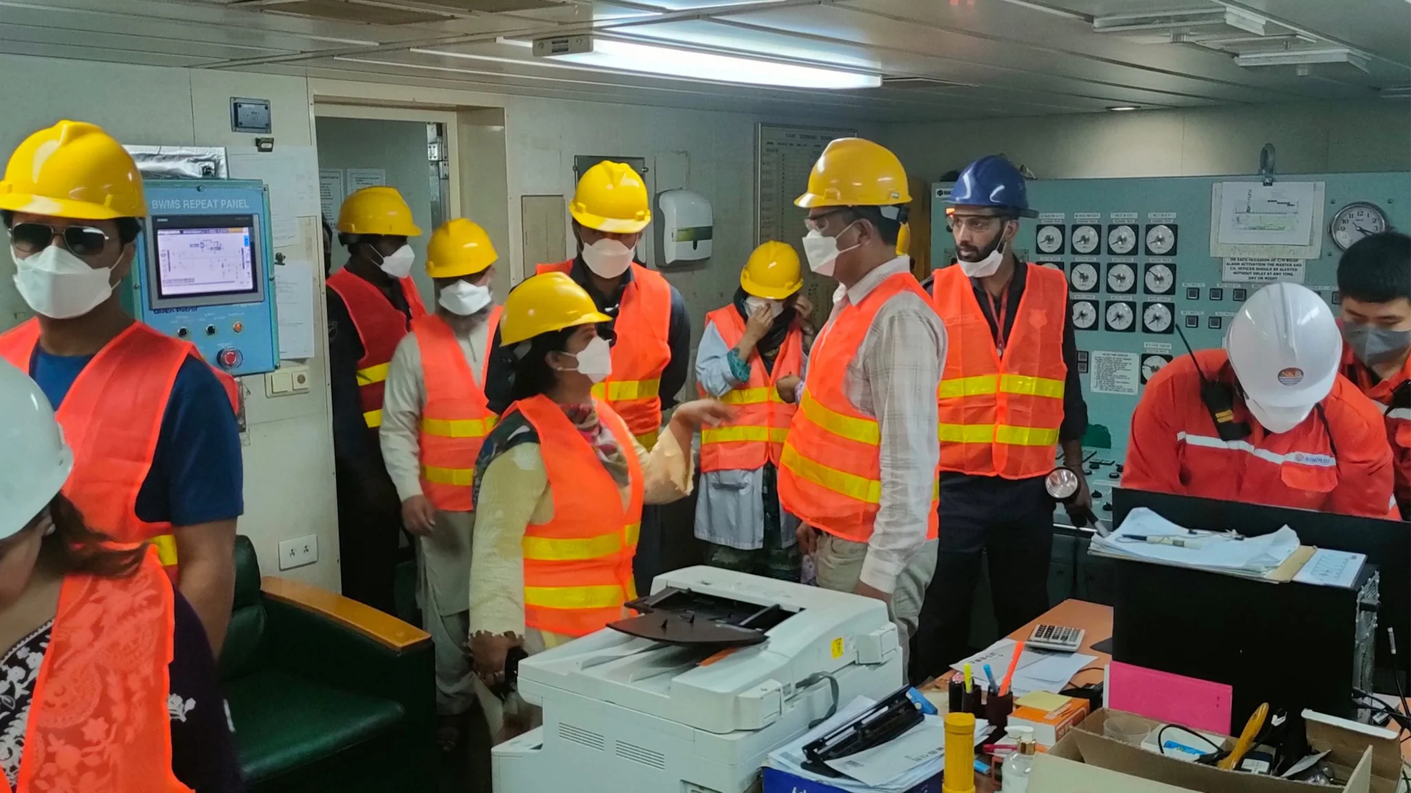 Pakistan-FELTP-Main inspection of the master control room on vessel, room filled with people wearing high vis gear