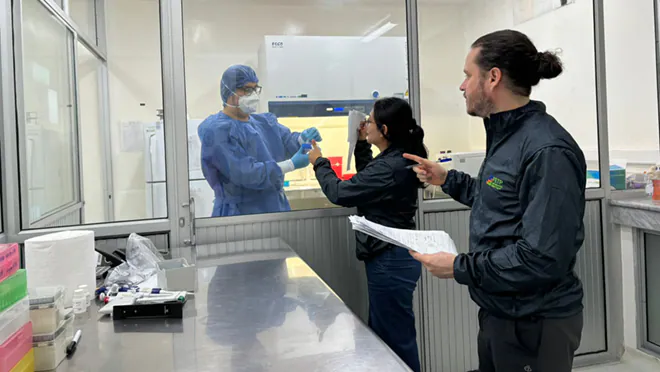 Ecuador_Avian_Flu_001 Three people in a laboratory.