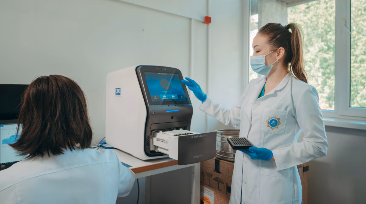 Kazakhstan CDC equipment A microbiologist in a lab takes samples from a CDC-donated equipment.