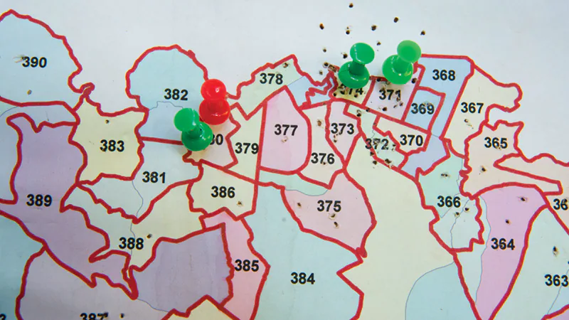 Map with Pins Map with numbered areas marked by green and red push pins indicating specific locations.
