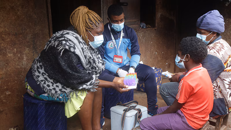 -- title missing -- Photo of people living with HIV receiving care during worldwide public health emergency.