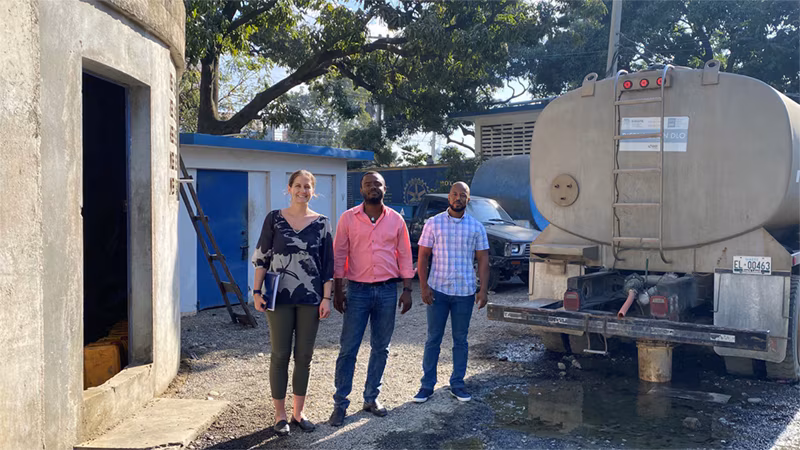 Cholera Response Work in Haiti_006 CDC WASH Specialist Taylor Osborne (left) met with Teddy Laroche (center) and Evenel Thermidor (right) from the National Directorate of Drinking Water and Sanitation and the Regional Office of Drinking Water and Sanitation in the North to assess whether the community has access to safe drinking water