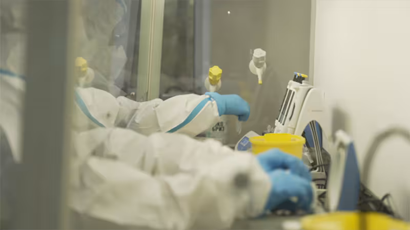 -- title missing -- people working in the lab