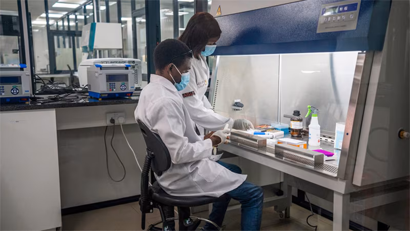 Long-term investments help COVID-19 response in Zambia_002 two adults working in the lab
