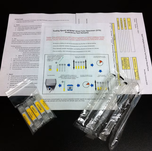2024_SuccessStory_WTBD A pamphlet, vials, and materials that are included in an Xpert TB Proficiency Testing program sample kit.