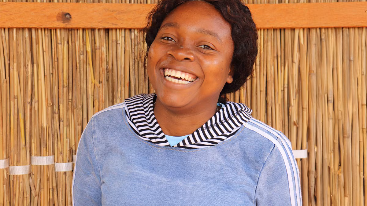 Portrait of a young woman smiling in Mozambique.