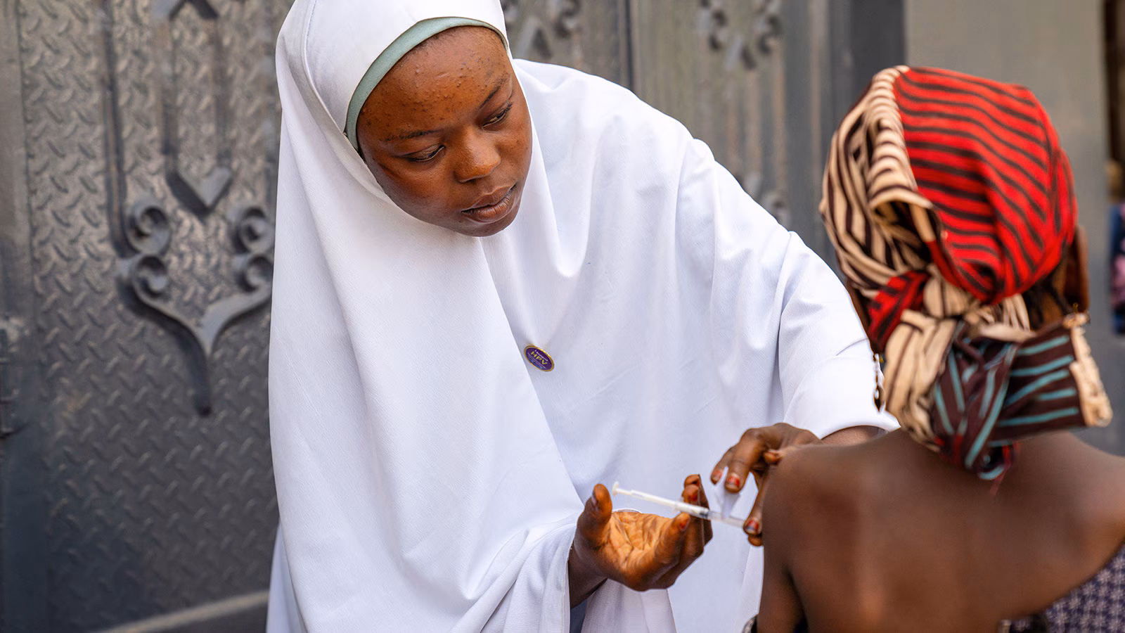 HPV vaccination in Nigeria A nurse administers a human papillomavirus (HPV) vaccine at a mobile clinic in Katsina, Nigeria