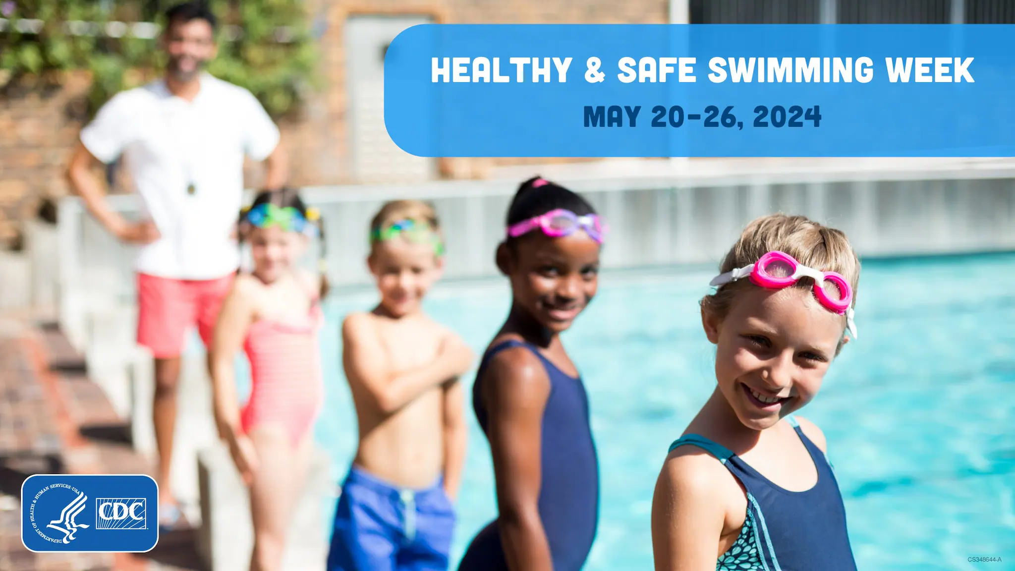 Healthy and Safe Swimming Week 2024 social media kids outside pool 1200x675 A group of children around 8-10 years old with goggles on their heads standing and the end of the pool next to each other and smiling.