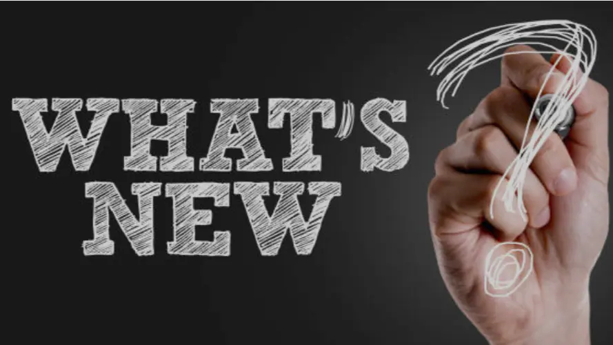 What's New Hand writing a word What's new in chalk display.