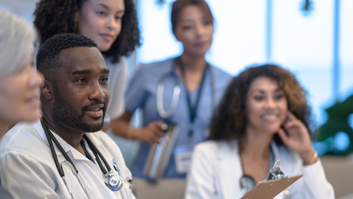 Hepatitis B Health Professional Resources Thumbnail A group of healthcare professionals sitting in a meeting