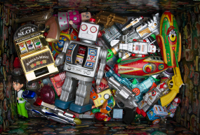 Box of old toys A box of old colorful metal toys.