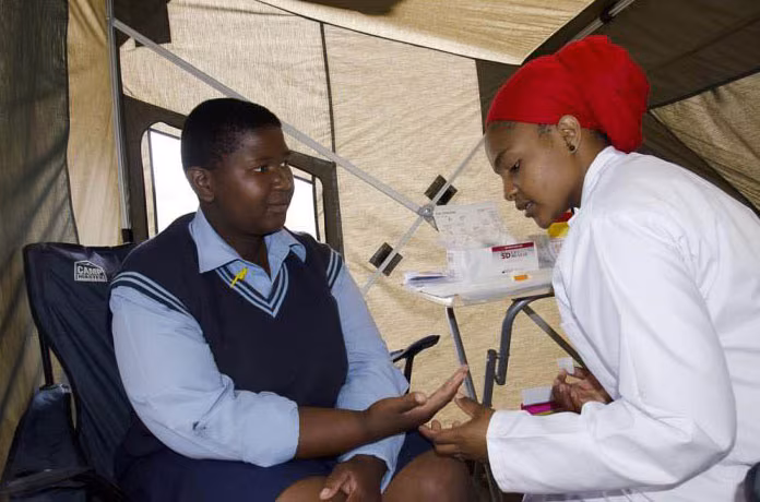 areas-study-public-health2 Two adults interacting in a medical tent