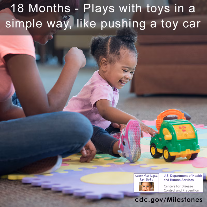 Plays with toys in a simple way, like pushing a toy car