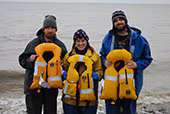 paul_revere_crew The three crew members of the setnet skiff Paul Revere posing on the shore of Bristol Bay, Alaska with the inflatable personal flotation devices that saved their lives.