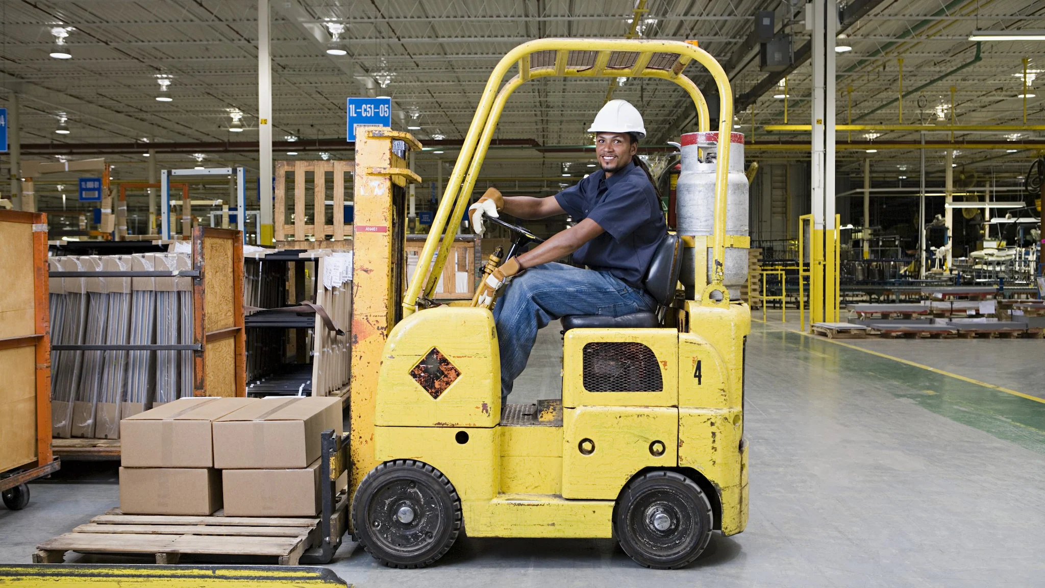 DSRAboutMachineSafetyThumbnailGetty A man sits in a forklift in a well-lit warehouse.