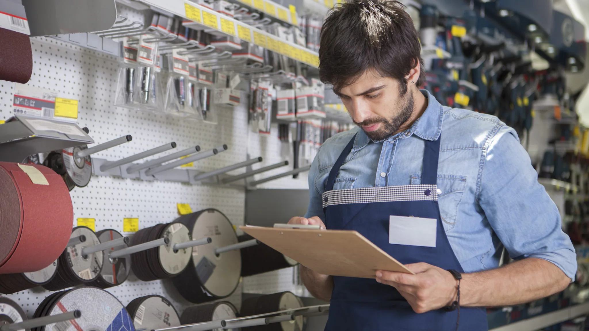 — title missing — Man working at hardware store