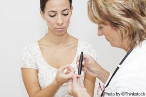 M3M person getting a finger stick to test blood glucose level