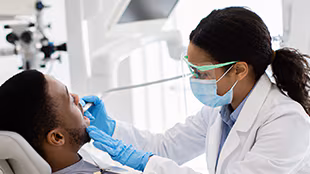 310x200 placeholder Female dentist with male patient