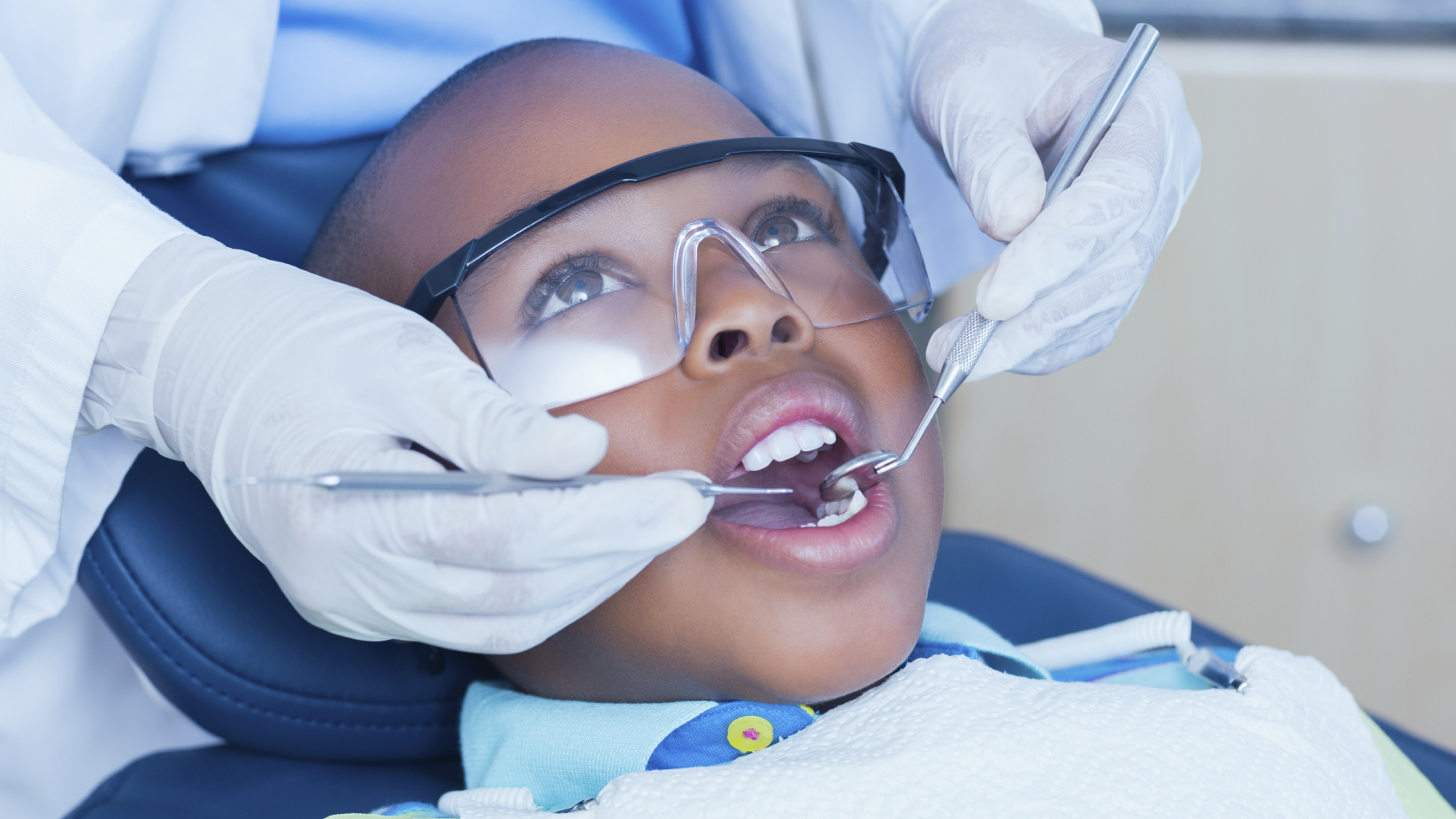 FF Dental Sealants Thumbnail A child's mouth being examined by health care professional.