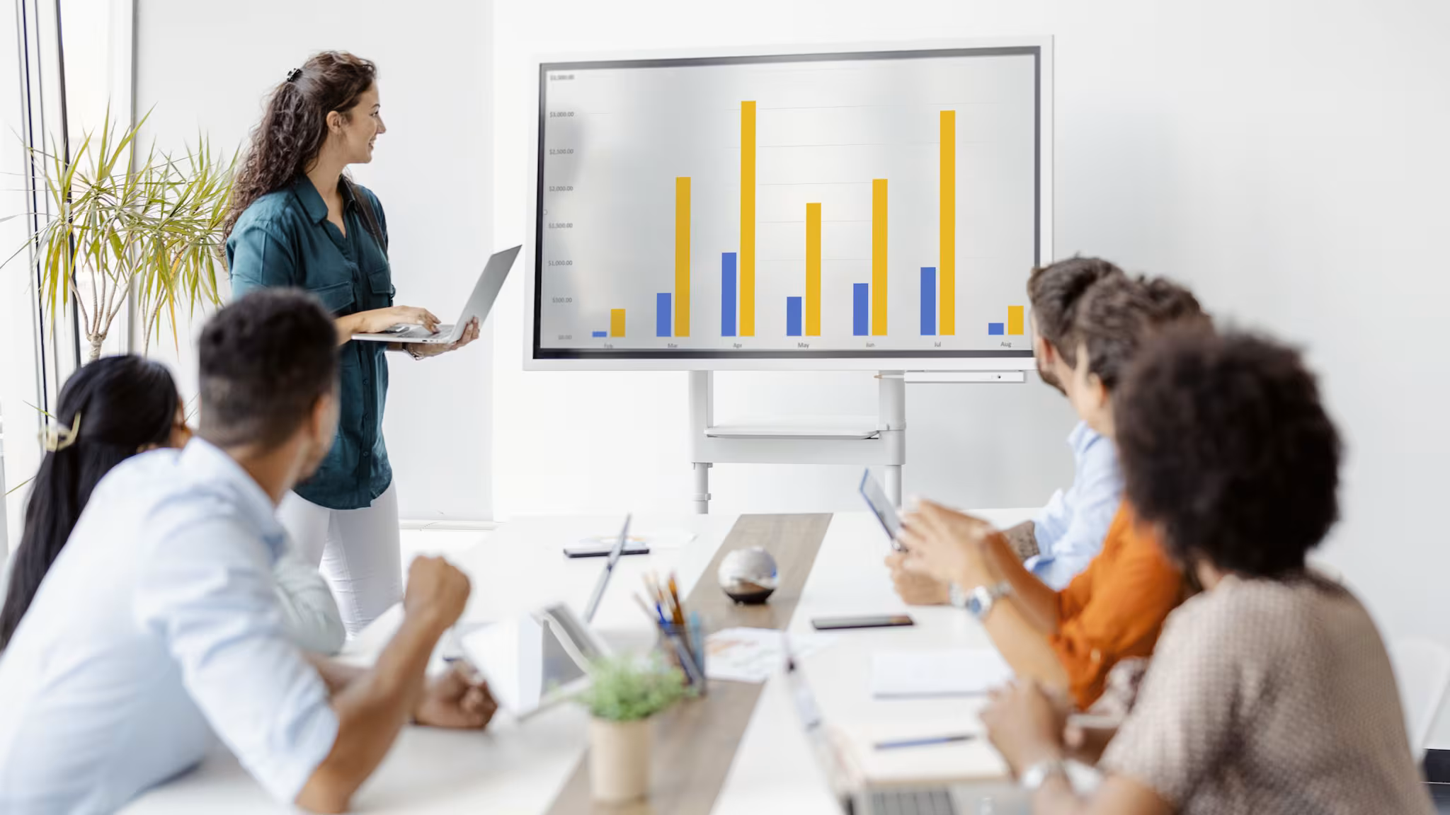 People looking over data charts and graphics.