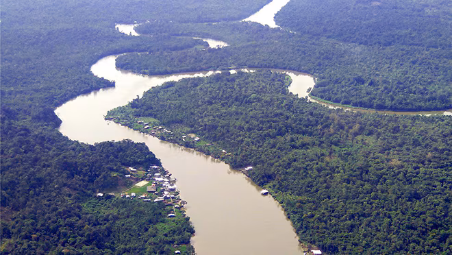 Localities-Cauca-Colombia-by-Raul-Pardo Arial view of the Cauca region, showing a winding river and a heavily forested area.