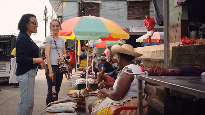 WMoD-Manuela-Nicole-community Two staff members chatting with residents of Guapi.