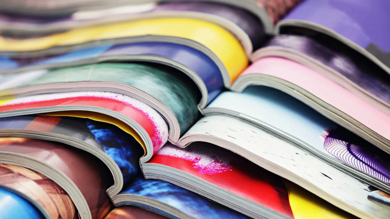 Investigation publications Stack of colorful journal magazines.