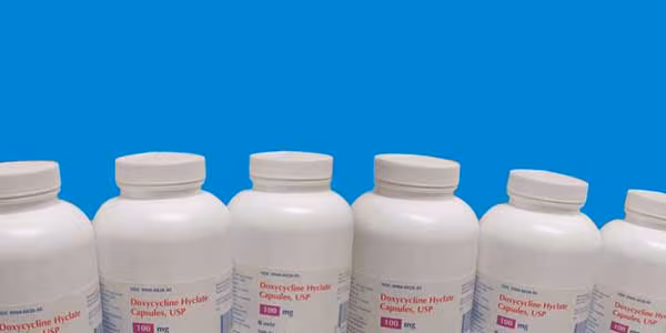 Bottles of doxycycline lined up beside each other.