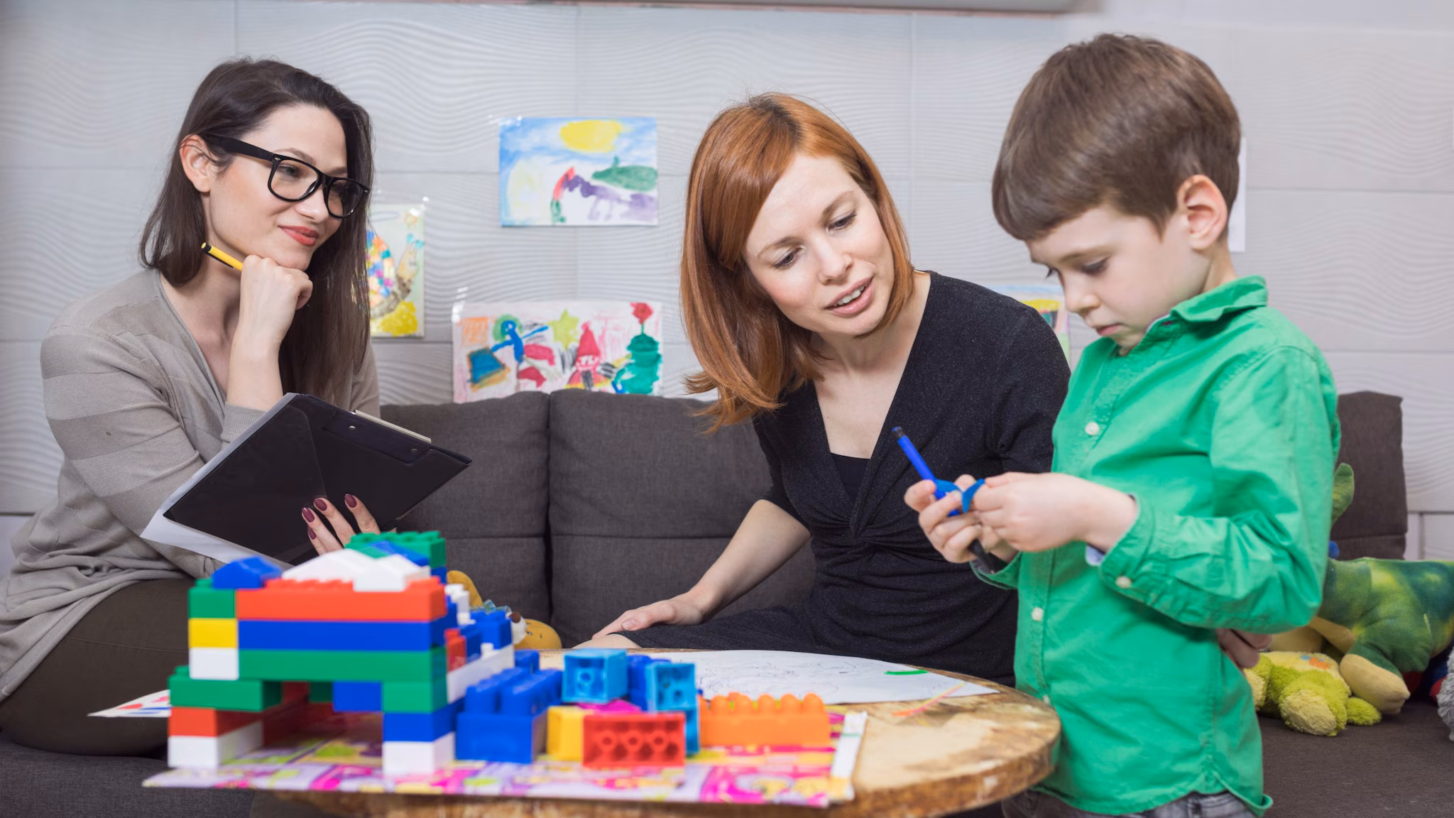 Child Psychologist at Work with a child and parent