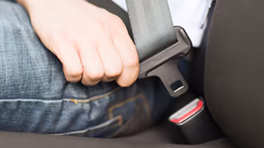 Photo male close up seat belt Close up of a man buckling his seat belt