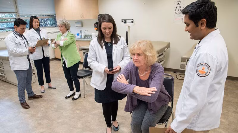 WomanReceivingCare A woman receives care from physical therapists.