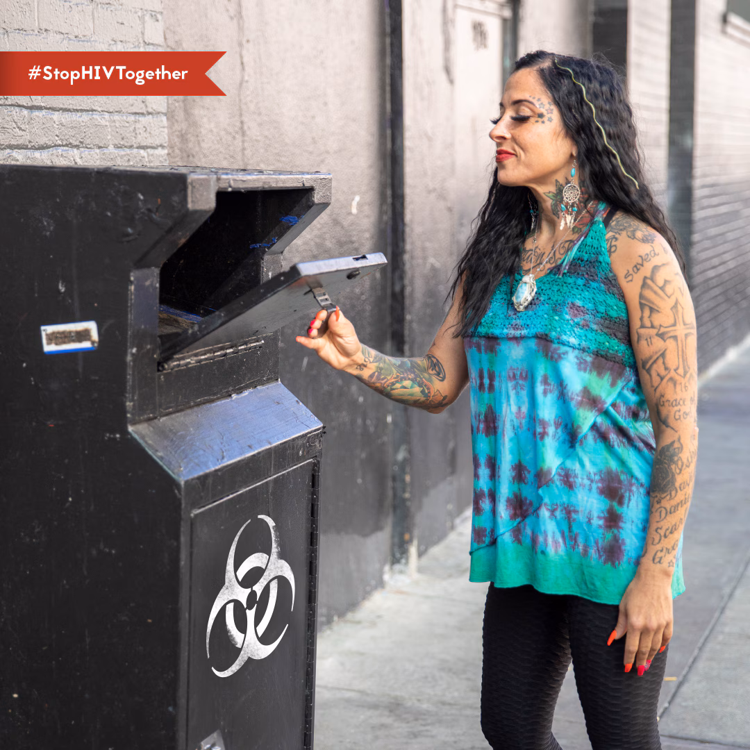 Person opening sharps/needles drop off box.