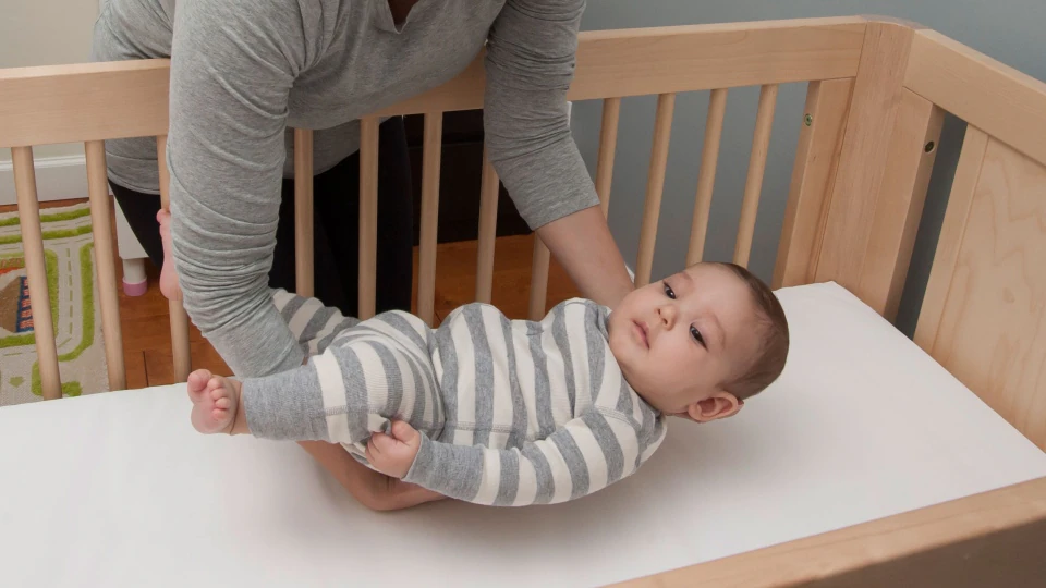 Helping Babies Sleep Safely Baby placed in crib on back
