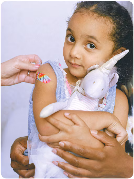vacc-confidence-girl Girl holding a stuffed animal