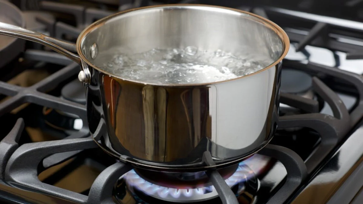 Rolling boil on stove Pot of boiling water on a gas stove